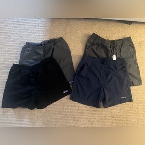 Set of 4 Patagonia Men's Athletic Shorts in Black, Charcoal, and Navy. Size: M